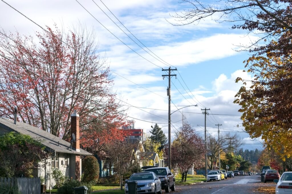 A street with cars parked on the side of it