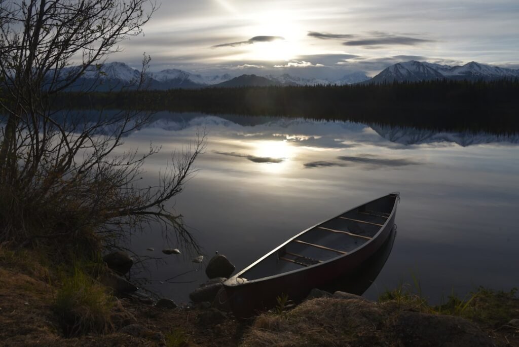 gray kayak on body of water