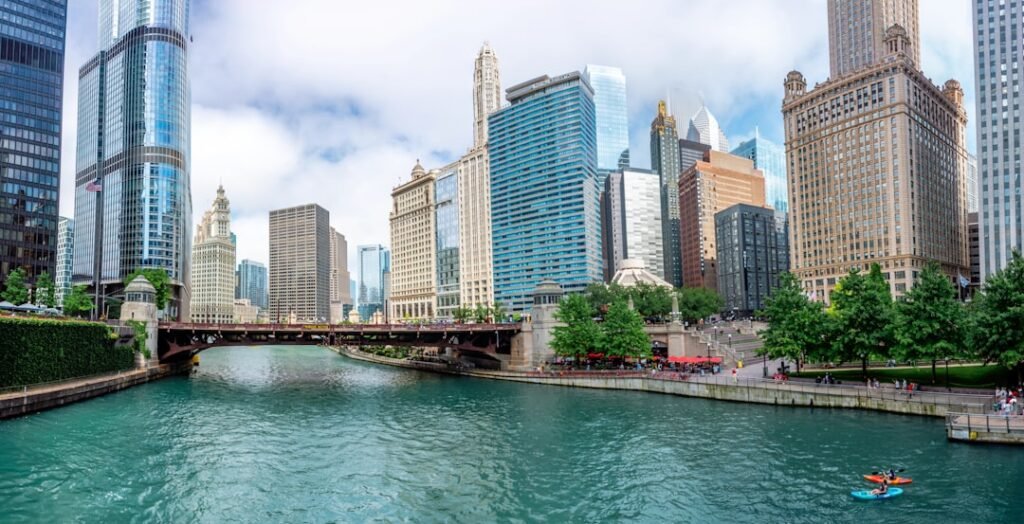 A river running through a city next to tall buildings